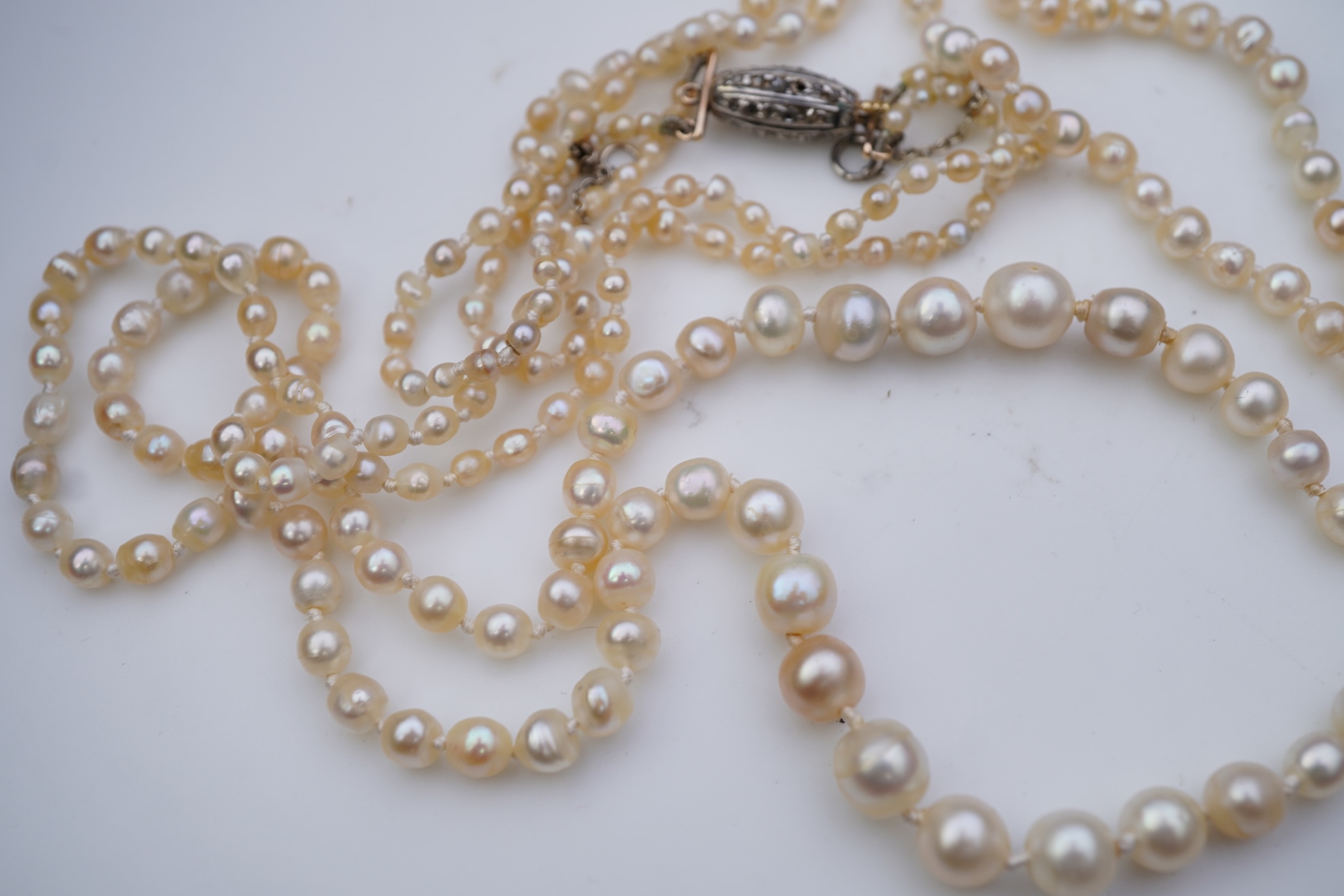 A natural pearl and diamond necklace, early 20th century